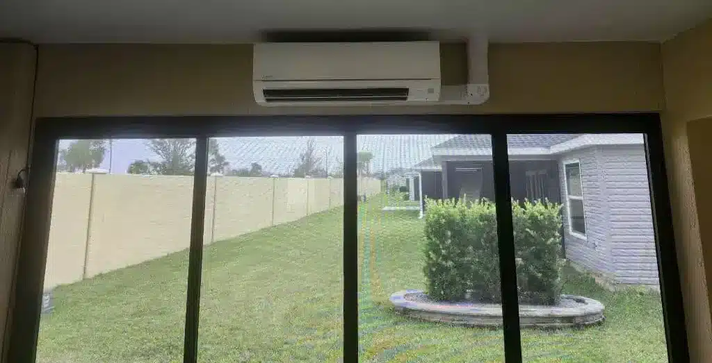 Mitsubishi ductless mini split wall unit providing sunroom cooling in a home in The Villages, FL