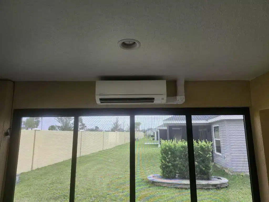 Mitsubishi ductless mini split wall unit providing sunroom cooling in a home in The Villages, FL
